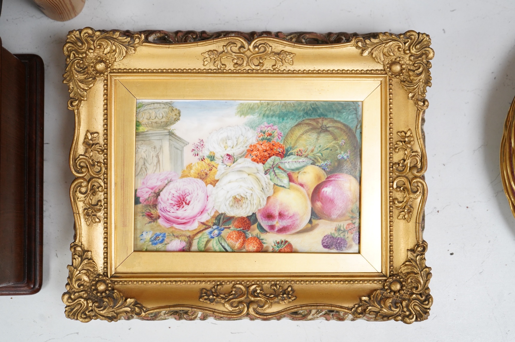 Two 19th century English porcelain flower or fruit painted plaques, each framed, largest overall 25 x 30cm